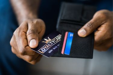 Man showing a loyalty card