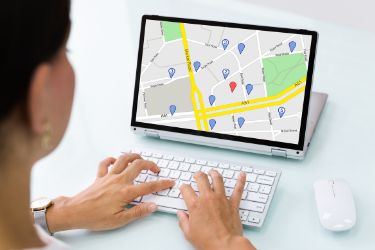 Woman looking for a business address in a map