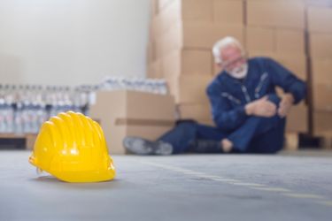 Old man on the floor after an accident at work