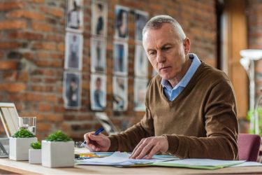 Man calculating costs