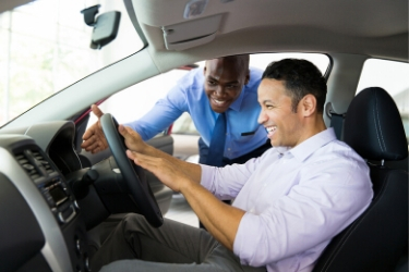 Seller pointing the features of the car