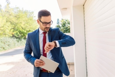Man checking his watch for the time