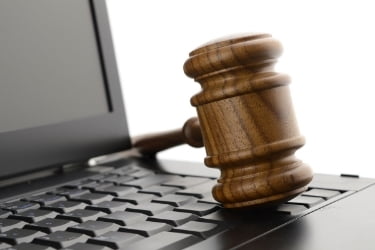 Gavel on top of a laptop