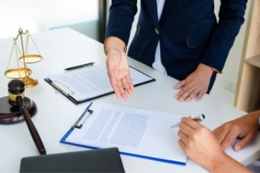 Lawyer explaining legal situation with contract papers