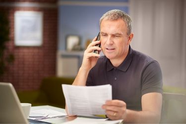 Business owner calling his customers
