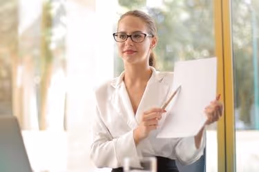 Woman showing a paper