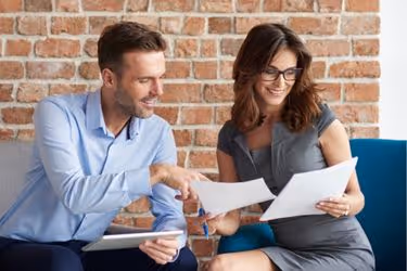 Two people discussing business