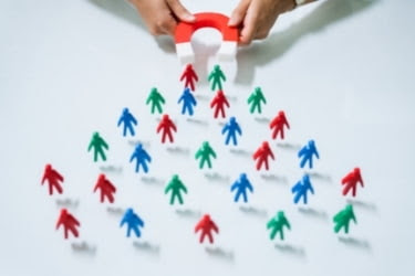 Magnet attracting people