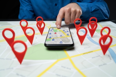 pointing to a map on a phone