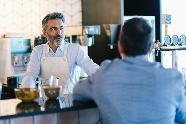 Business owner engaging with customer