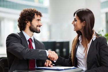 Man closing a sale with a woman