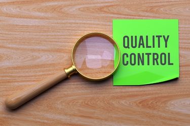 Magnifier with the word "Quality Control"