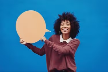 Woman holding a speech bubble