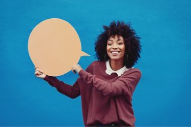 Woman holding a speech bubble