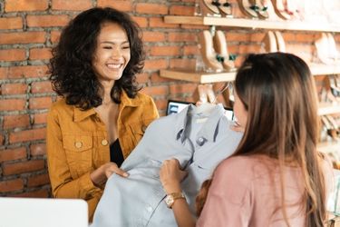 Woman selling a shirt