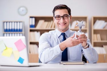 Man posing with an award