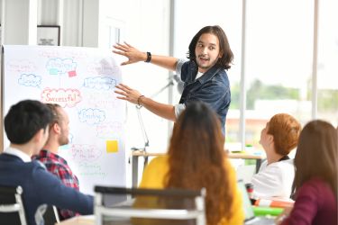 Man doing a presentation while audience is engaged