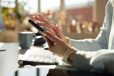 Woman using social media on her mobile phone