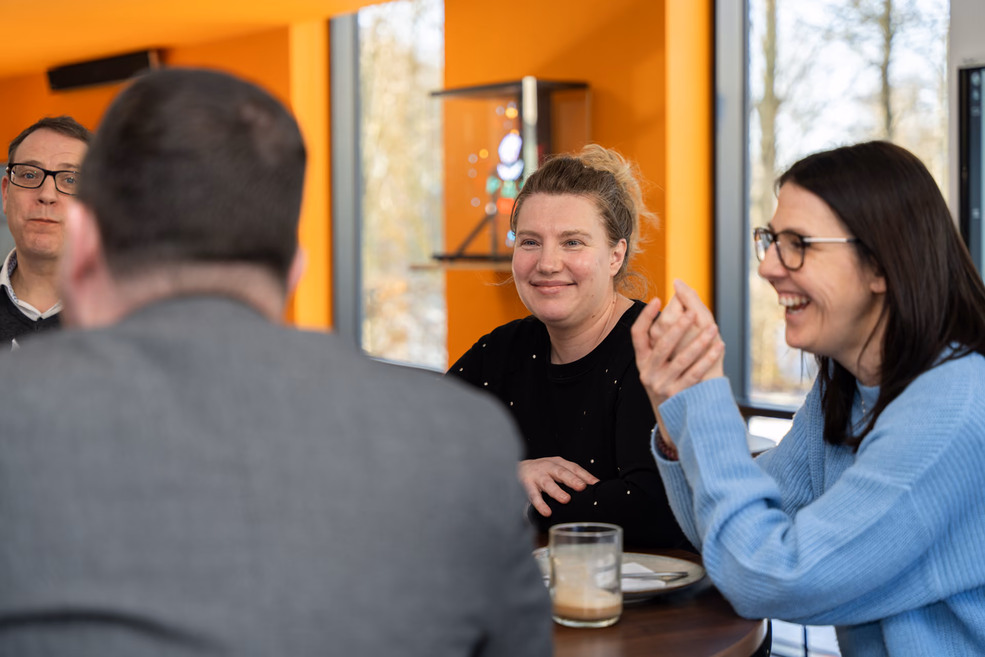 A smiling teacher happy to be involved decision making