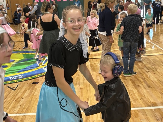 AcademyACL families celebrating together at a school event