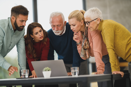 A group working on a laptop