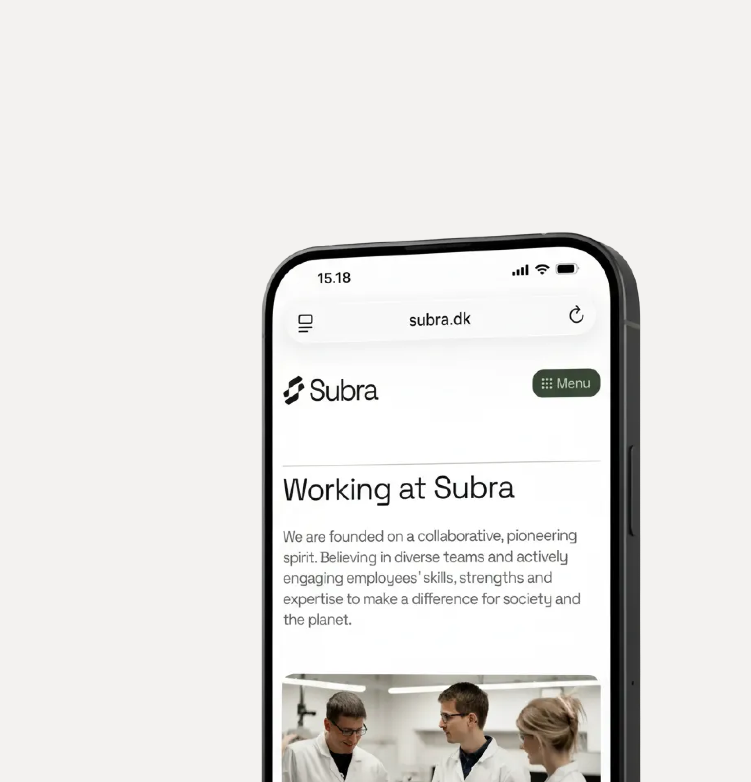 Mobile phone screen showing Subra website's 'Working at Subra' page with text about collaborative spirit and a photo of three people in lab coats.