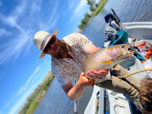 Man holding cutthroat trout.