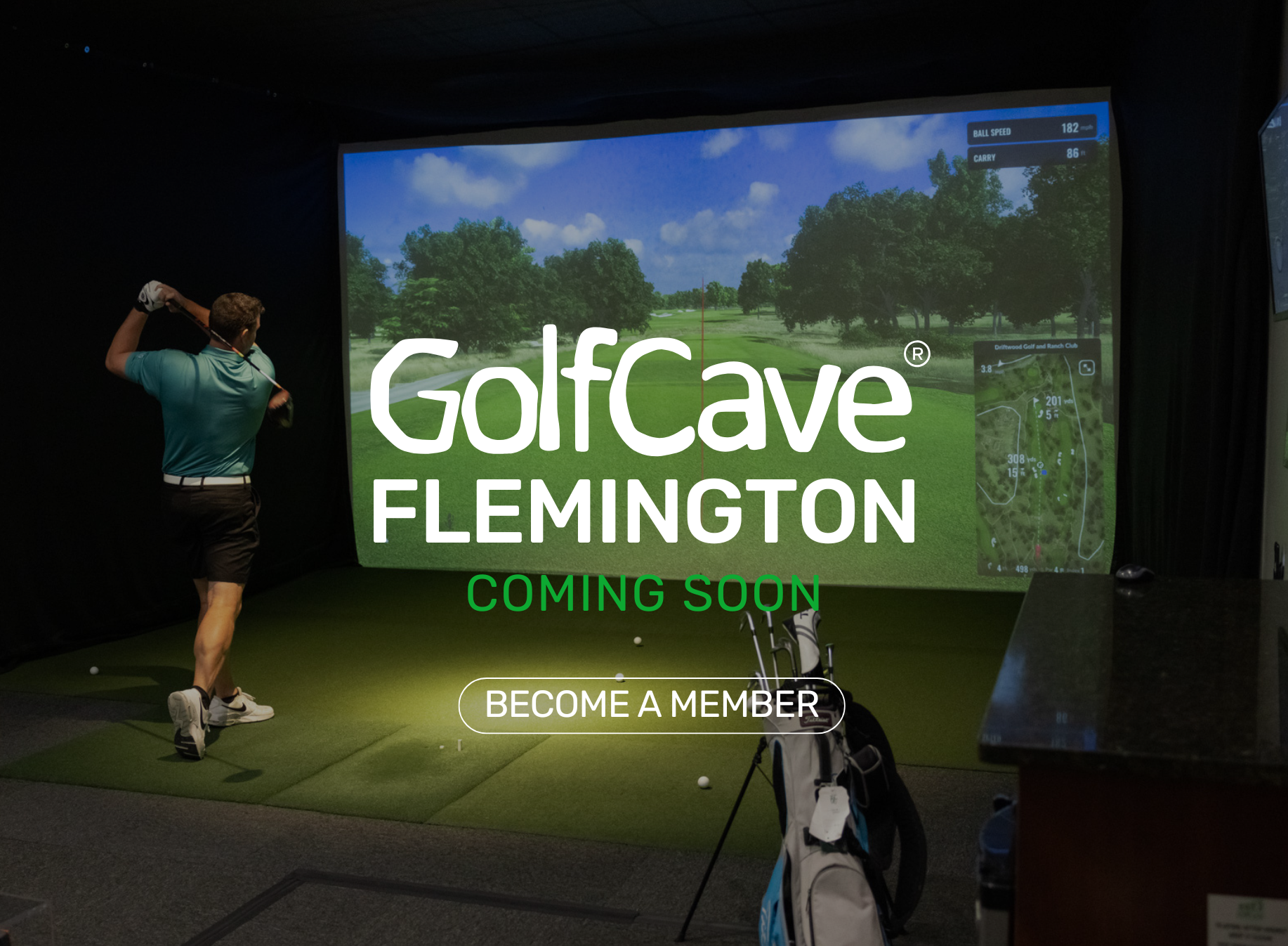 Two men playing golf at the GolfCave. One man is over the ball about to hit while the other watches