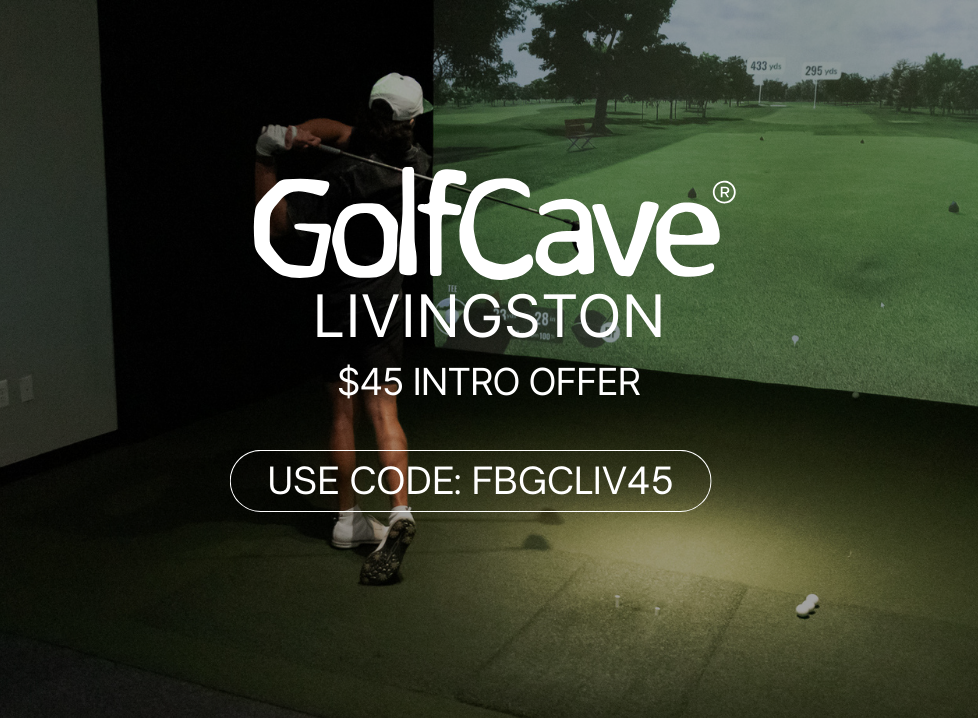 Two men playing golf at the GolfCave. One man is over the ball about to hit while the other watches