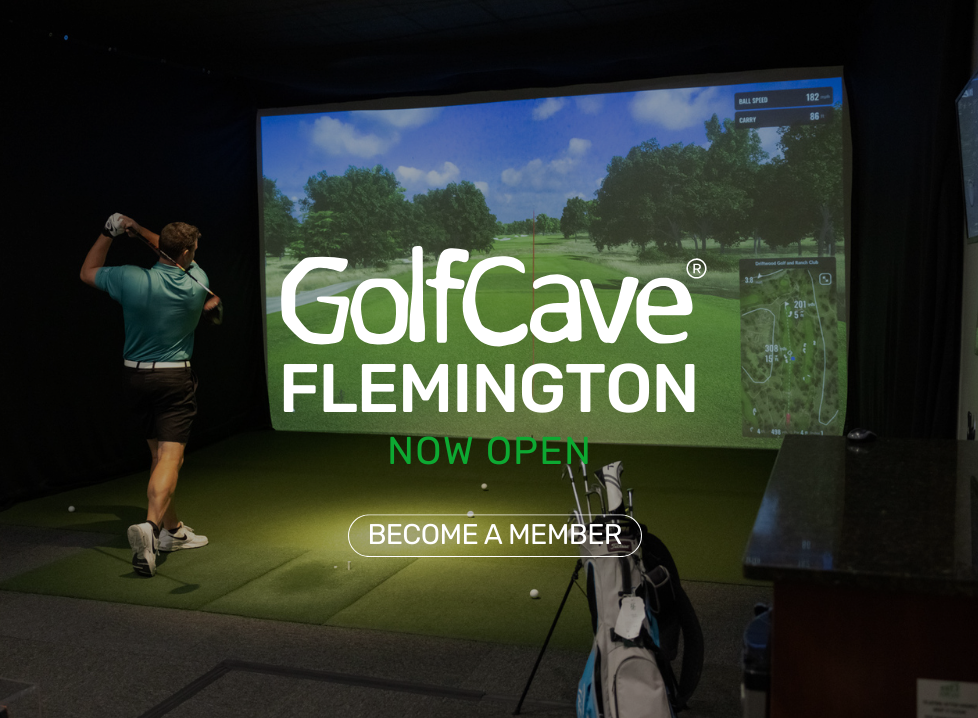 GolfCave Flemington is Now Open. Showcasing a man swinging inside a private Cave. 