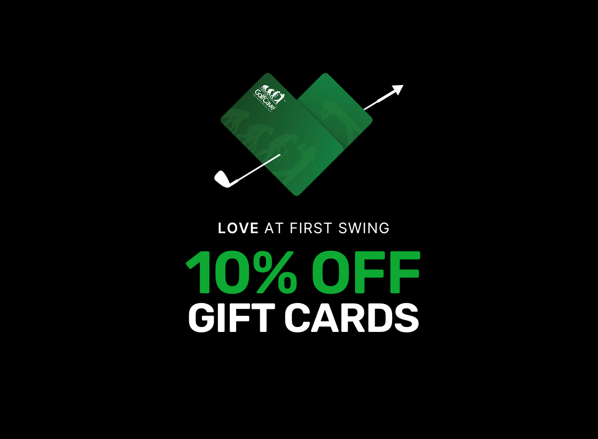 Two men playing golf at the GolfCave. One man is over the ball about to hit while the other watches