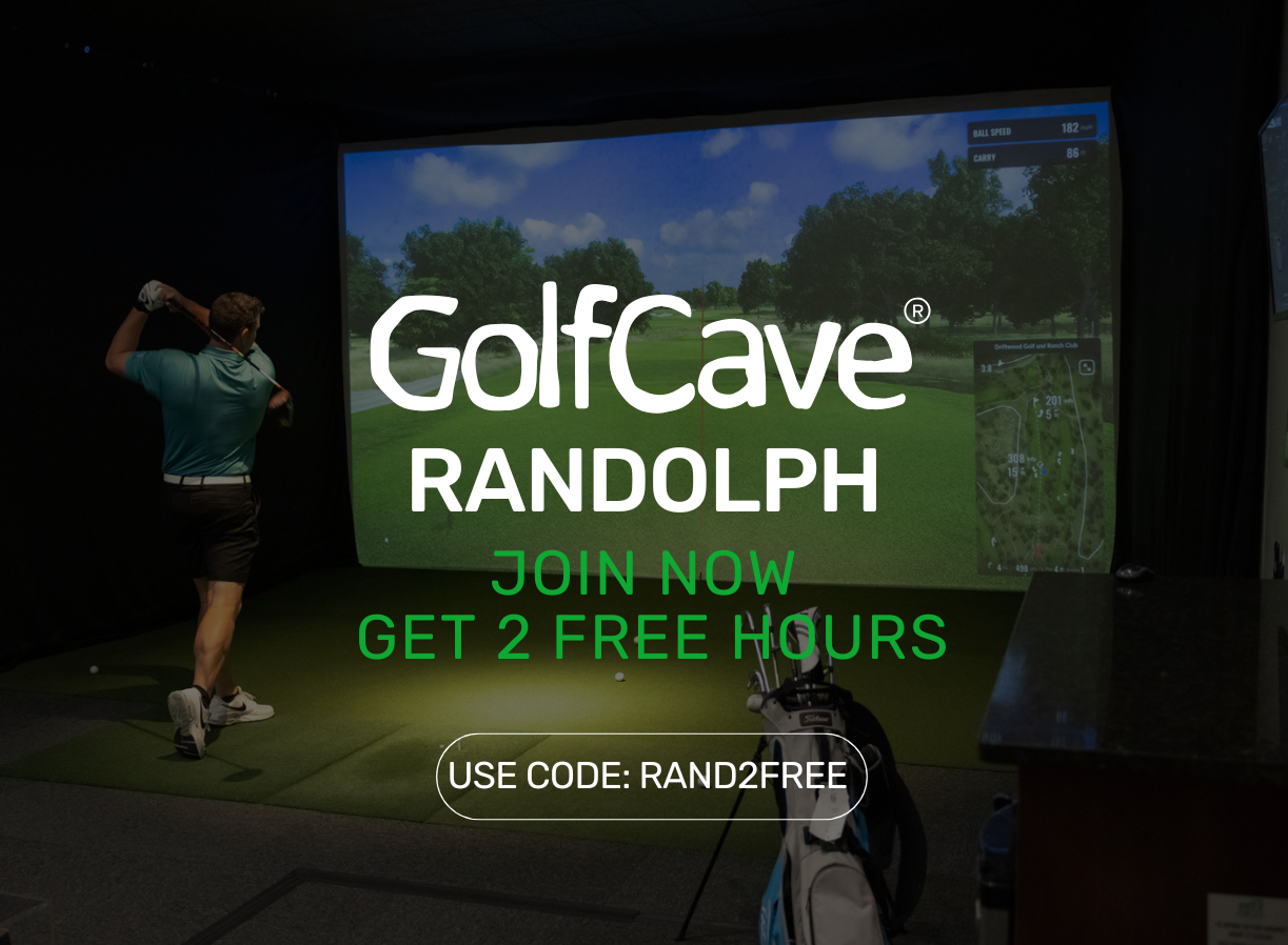 Two men playing golf at the GolfCave. One man is over the ball about to hit while the other watches