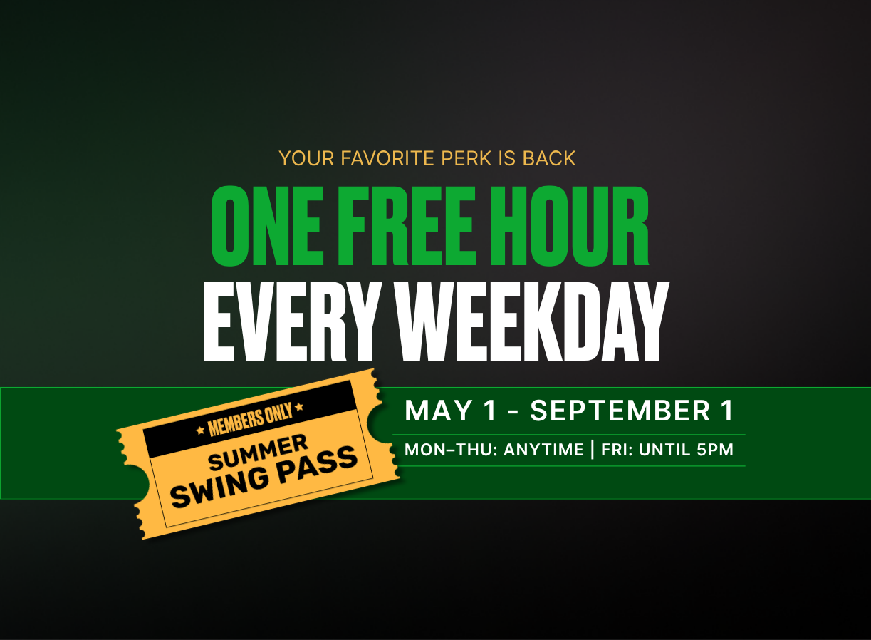 Two men playing golf at the GolfCave. One man is over the ball about to hit while the other watches