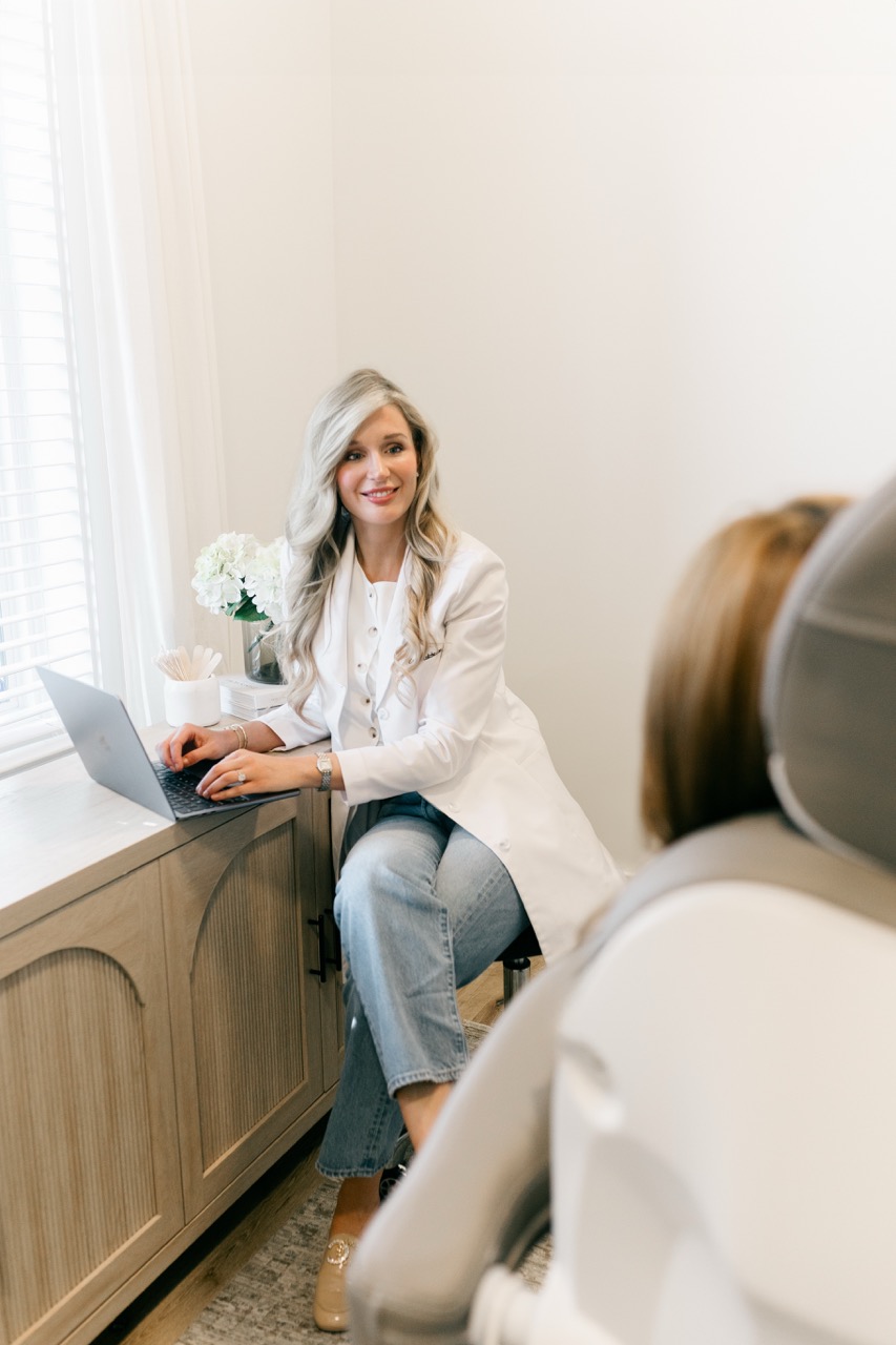 A Woman Is Seating While Having A Cosmetic Consult For Botox And Fillers