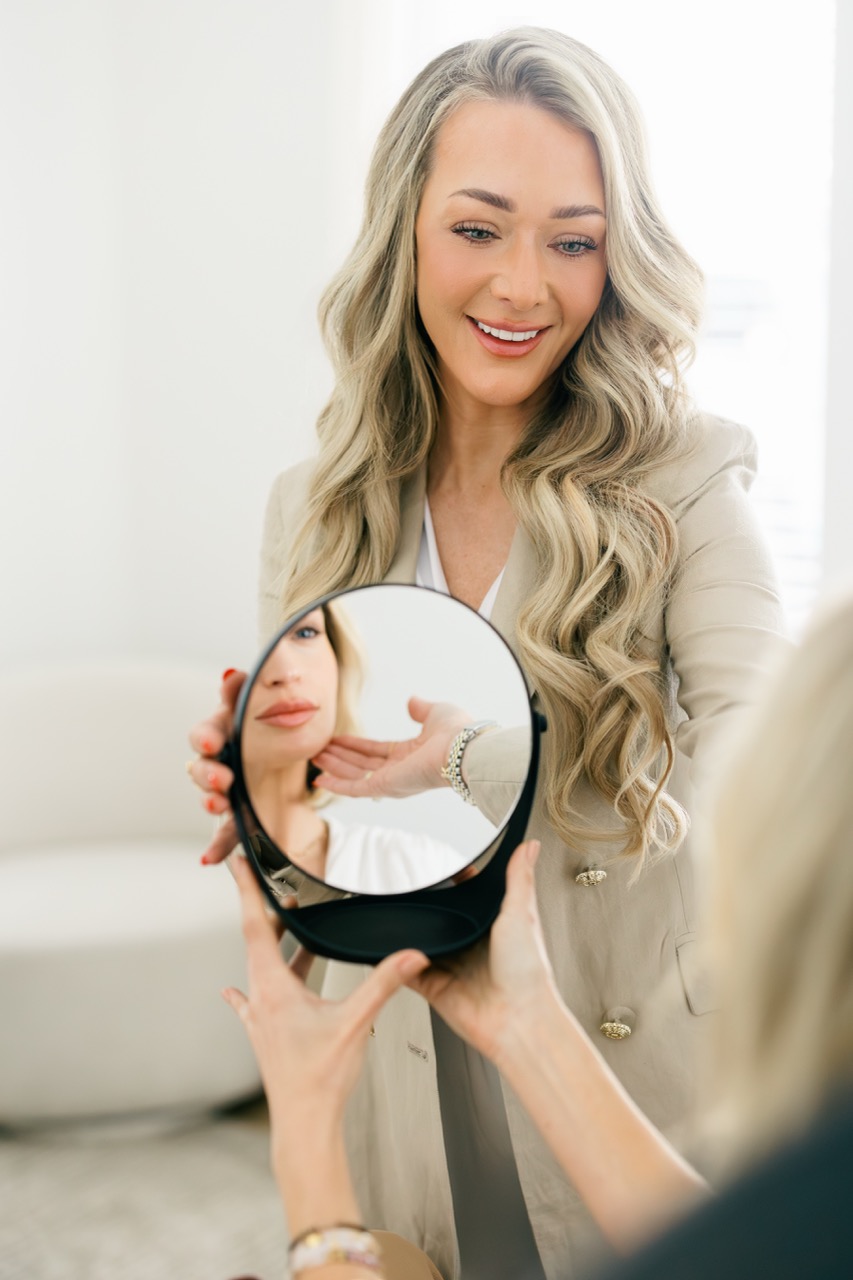 A Woman Is Seating While Having A Cosmetic Consult For Botox And Fillers