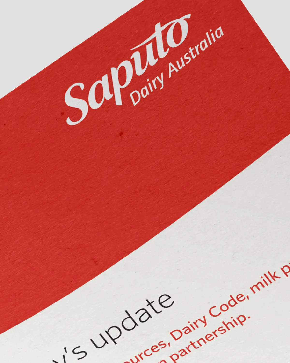 Close-up of a document with Saputo Dairy Australia logo on red background at top.