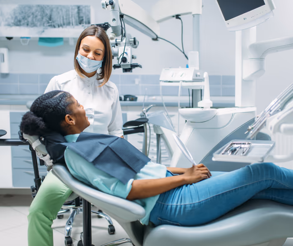 Dentist and patient together in a dental office, showing success from Local SEO for Dentists.