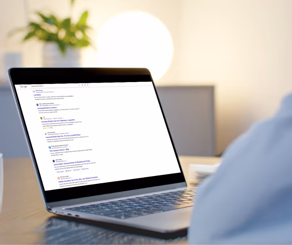 Open laptop with Google results page featuring blue links for WordPress SEO Services.