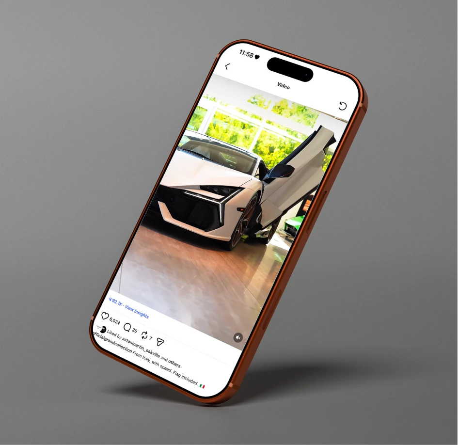 Smartphone displaying a Lamborghini post with engagement metrics, highlighting performance-driven social media strategy