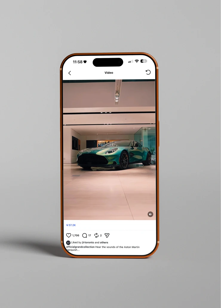 Smartphone displaying a luxury vehicle video post on Instagram, reflecting high-performance content within The Grand Collection feed