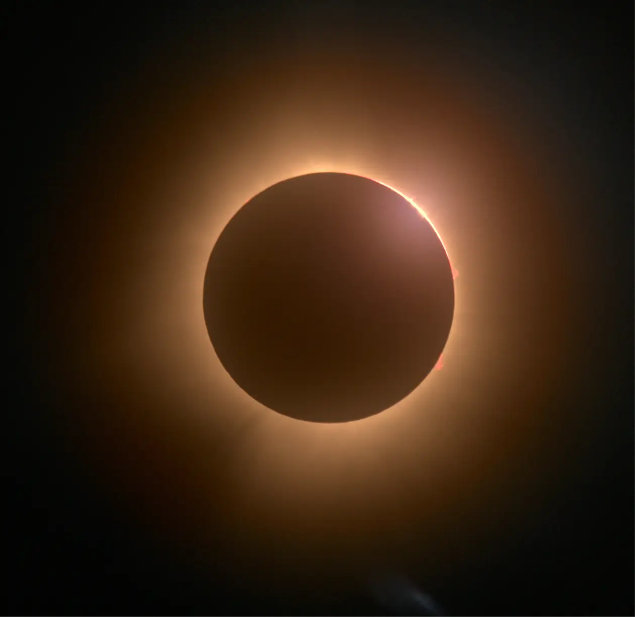 Close‑up of the 2024 total solar eclipse showing the glowing solar corona and diamond‑ring effect, representing the inspiration behind Rolls‑Royce Ékleipsis design.