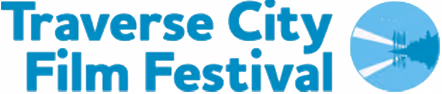 Traverse City Film Festival logo with text and stylized image of a lighthouse casting light beams over water.