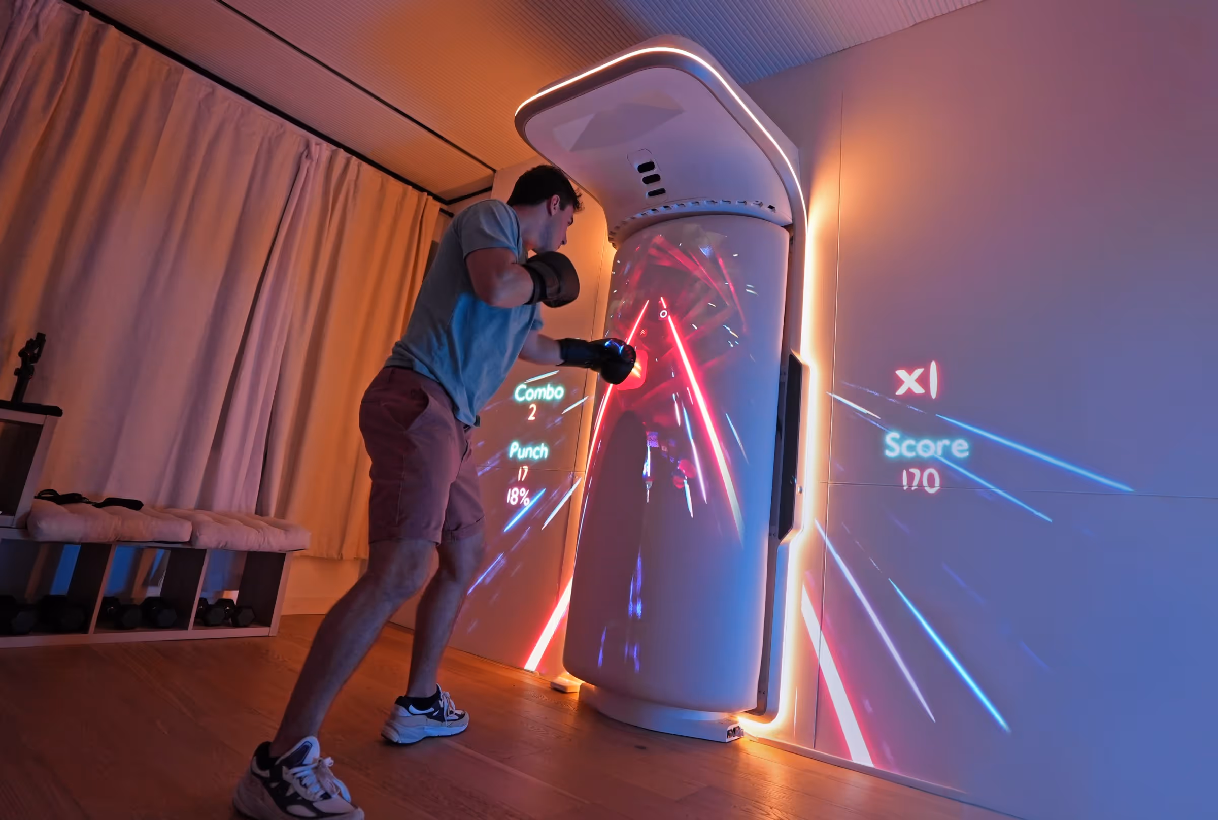 A person wearing boxing gloves punches the Growl’s interactive display.