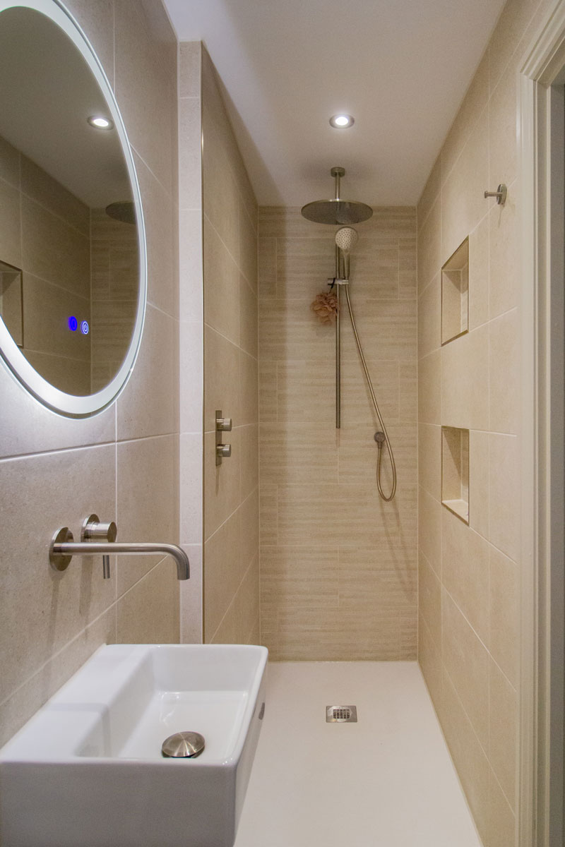 En Suite bathroom with walk in shower and sandstone tiles