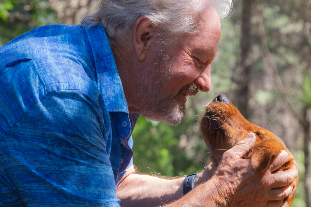 Mark Vette with his golden retriever puppy