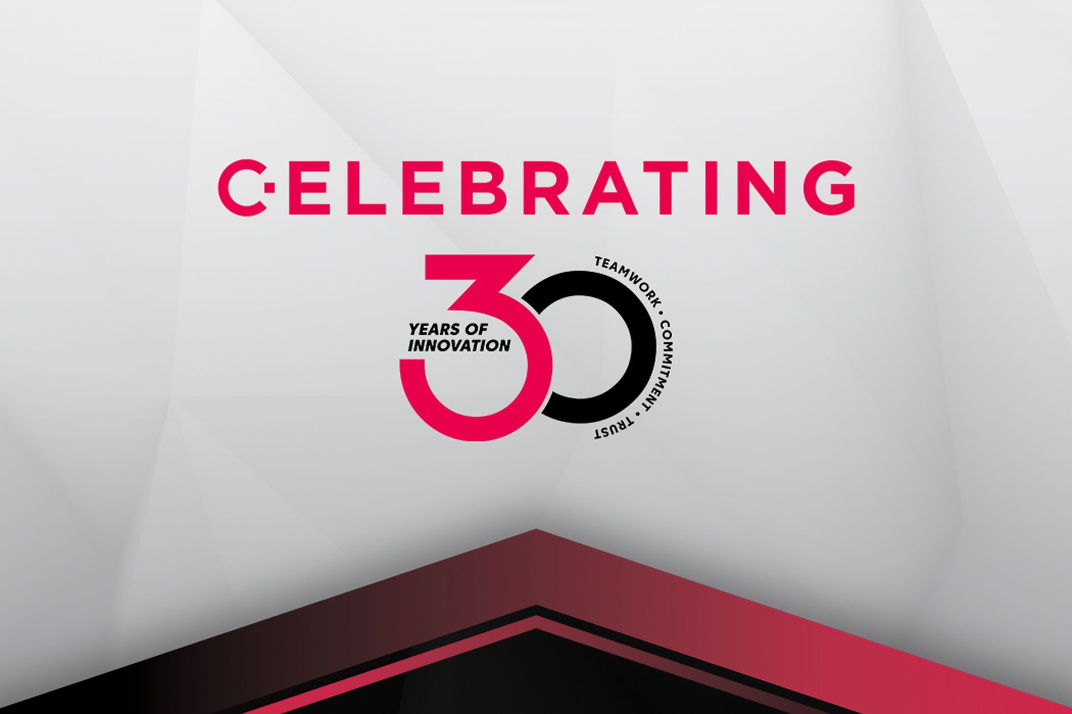 Person working at a desk with a computer, reviewing an online form related to policy management on a monitor, and taking notes in a notebook. A laptop and office supplies are also on the desk.