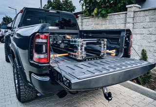AUN 250 folding motorcycle ramp in a pickup truck