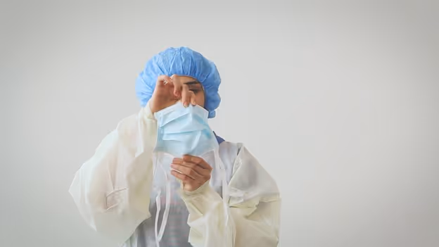 Medical professional expanding pleats on a PRIMED surgical tie face mask