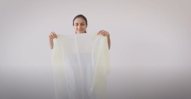 donning and unfolding single-use gown