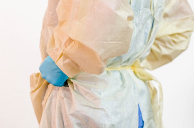 Doffing gown by pulling at the waist